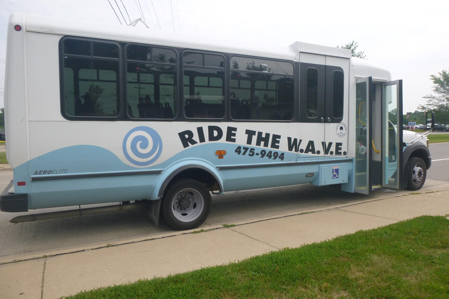 WAVE bus parked near the curb